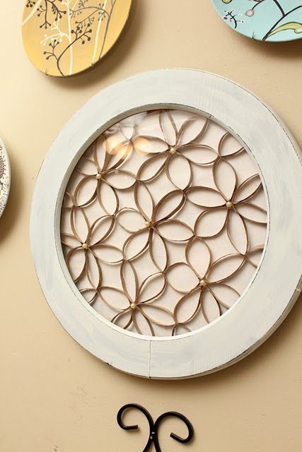 Cute Idea!!!!  Toilet paper roll flowers with pearls in the center, then frame i
