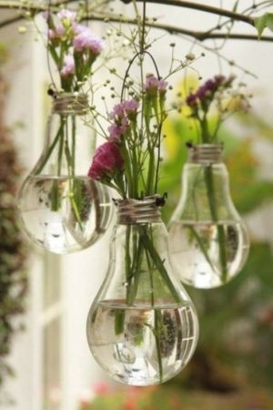 Recycled light bulb vases. Really lovely and sweet idea for an outdoor picnic or