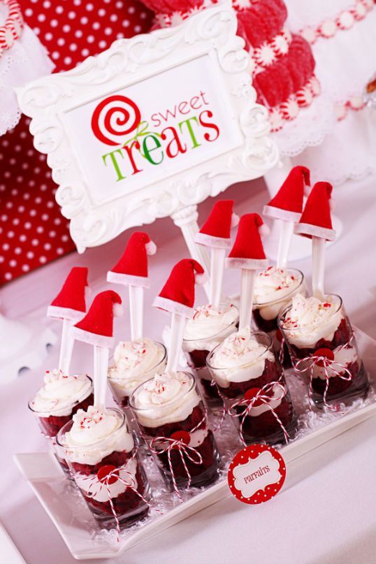 Red velvet parfaits served with a Santa hat topping the spoons, holiday party id