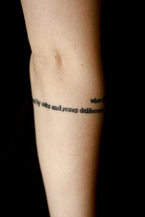 This is part of an E.E. Cummings poem on Genevieve’s right arm. It reads,