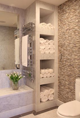 bathroom with shelves for towels // love how this feels like a spa!