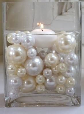 centerpiece made of pearl beads and floating candle- these are pretty much my st