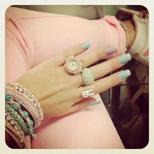 pastel nails, stacked colorful bracelets, pink pants