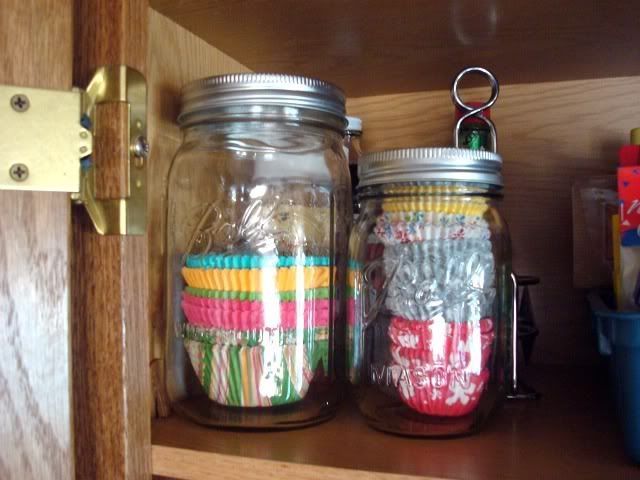 store cupcake liners in mason jars – I always have extras and they always get sm