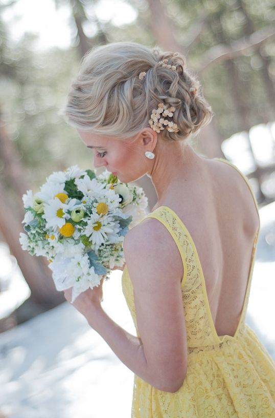 Bridesmaid in yellow lace dress.