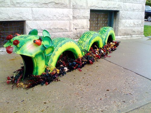 Colorful dragon made from used tires.