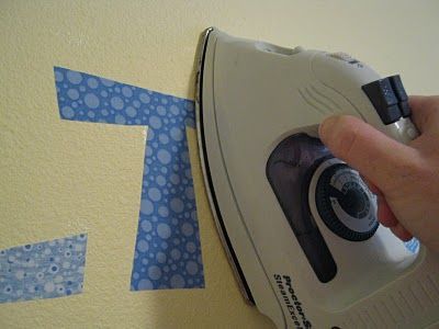 Didn't know you could iron fabric onto the wall? Just as easy as vinyl! Peel