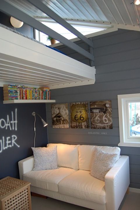 Grey painted wood paneled walls with painted wood paneled ceiling. I love this!