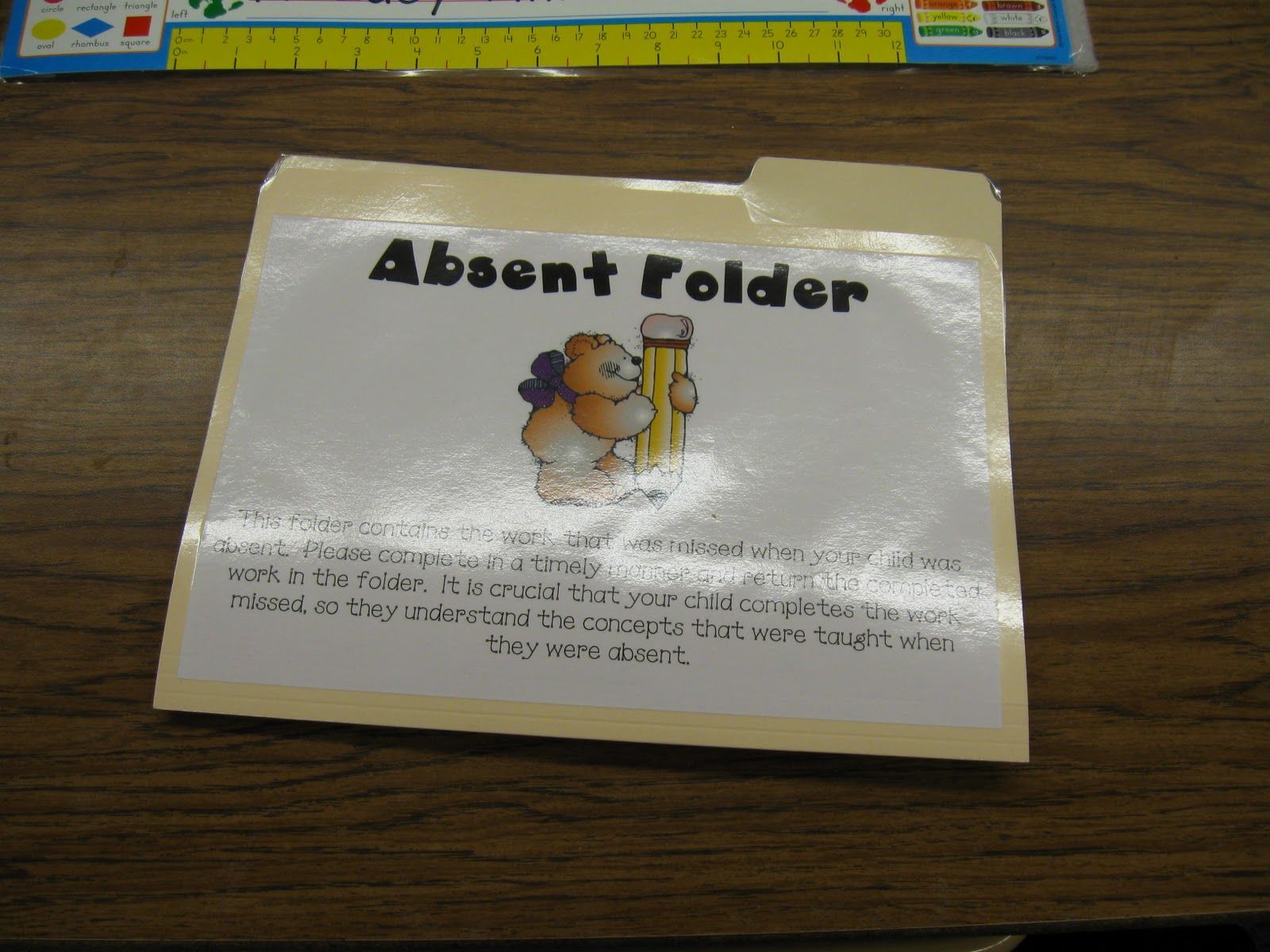 I put an absent folder on my absent student's desk.  The students at their t
