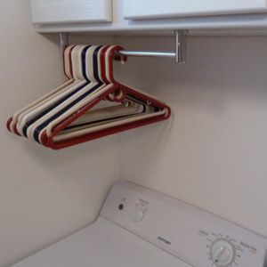 Mount a short towel bar under a cabinet in your laundry room for instant hanger