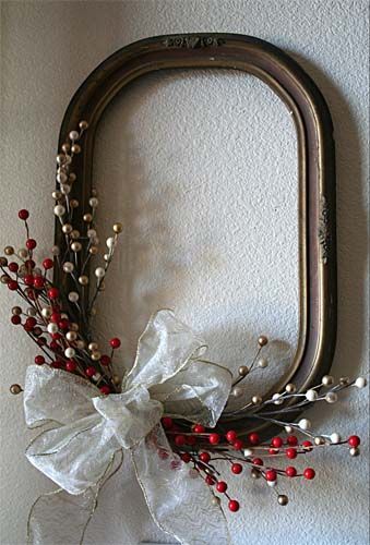 Re-purpose an empty frame. Decorate it just as you would a wreath.