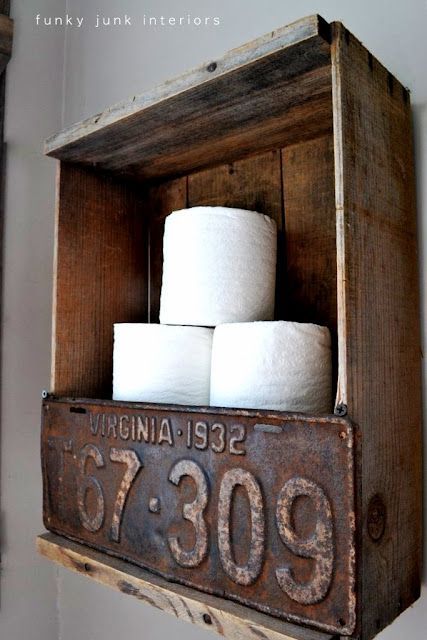 Rustic crate and license plate toilet paper holder by Funky Junk Interiors.