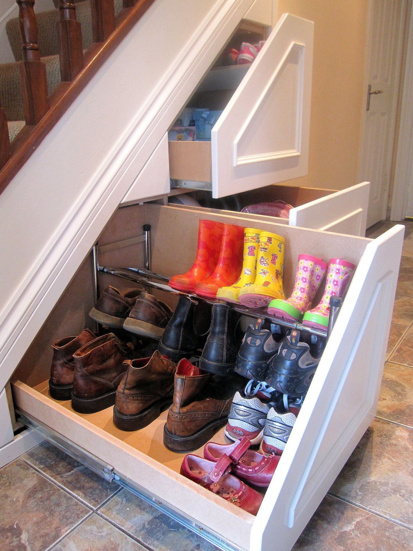 Shoe storage under stairs…brilliant!