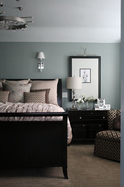This master bedroom is decorated painted a tranquil grey for a soothing atmosphe