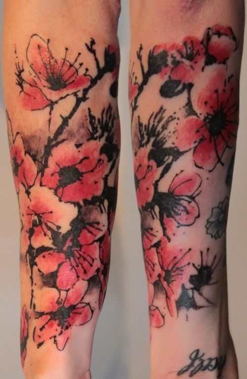 Unique cherry blossom tattoo..almost like watercolor ink.