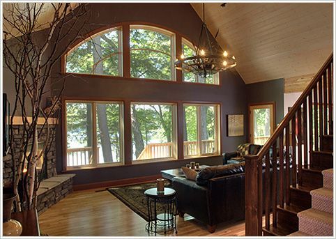 love the windows, chandelier, corner fire place