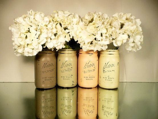painted and distressed mason jars with fake hydrangeas :) Super cute and cheap