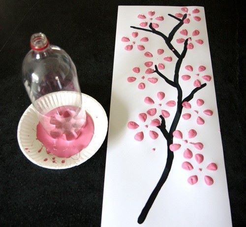 simply use an empty soda bottle and dip it in paint to create cute flowers!