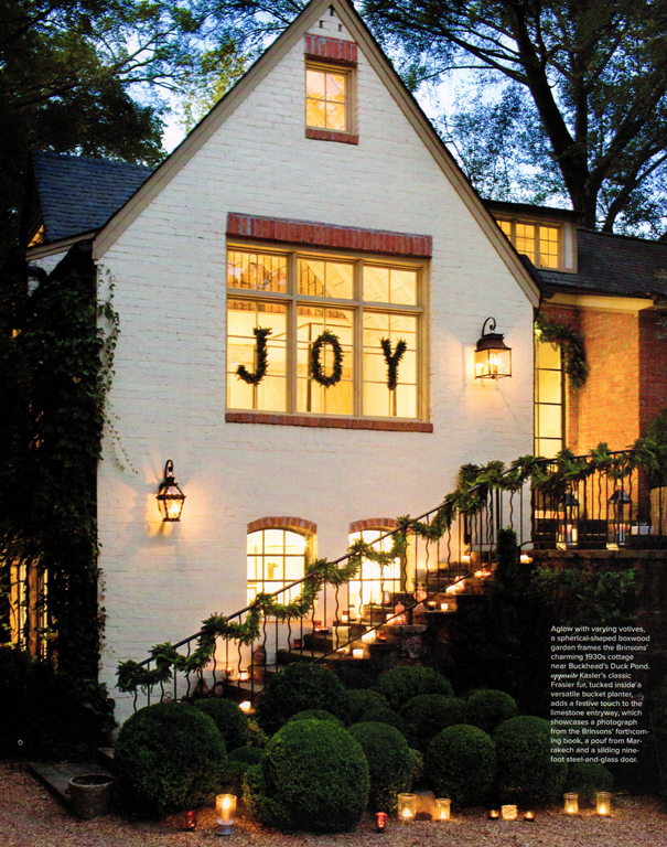 white brick house exterior decorated for Christmas
