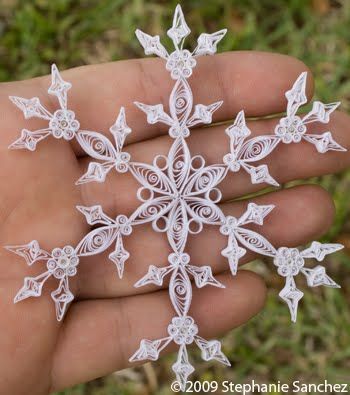 A number of quilled snowflakes
