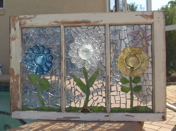 Glass glued to original glass and grouted and recycled dishes used for flowers