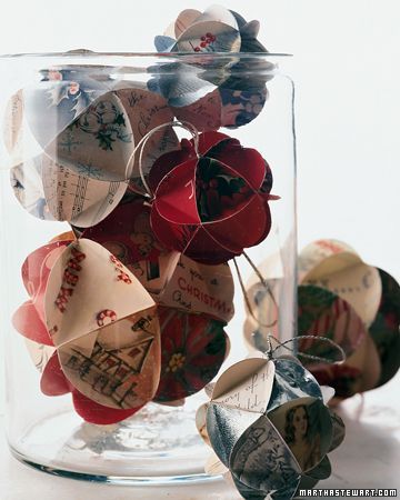 Reuse old Christmas cards to make ornaments.  I love the look of these ornaments