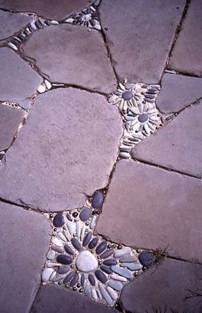 What a great way to fill in the crevices !  Flower mosaics…