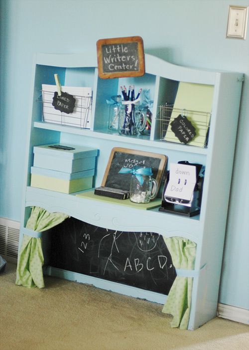 What a cute idea to repurpose and old shelf or hutch to make a little center for