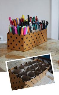 A way to keep pens out and available, with toilet paper rolls and a fancy box.