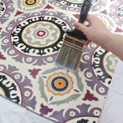 Make your own custom rug out of any fabric you love from the craft store! This i