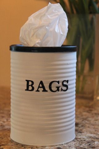 Re-use a coffee can to dispense plastic bags! Keep it under your sink for easy a