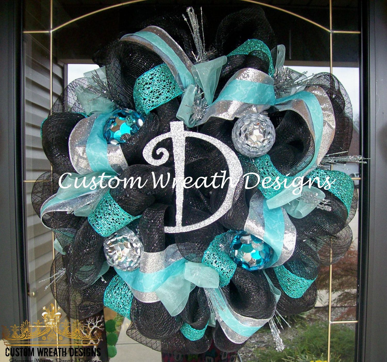 Black and Turquoise Christmas Wreath ( letter of choice ). $95.00, via Etsy.