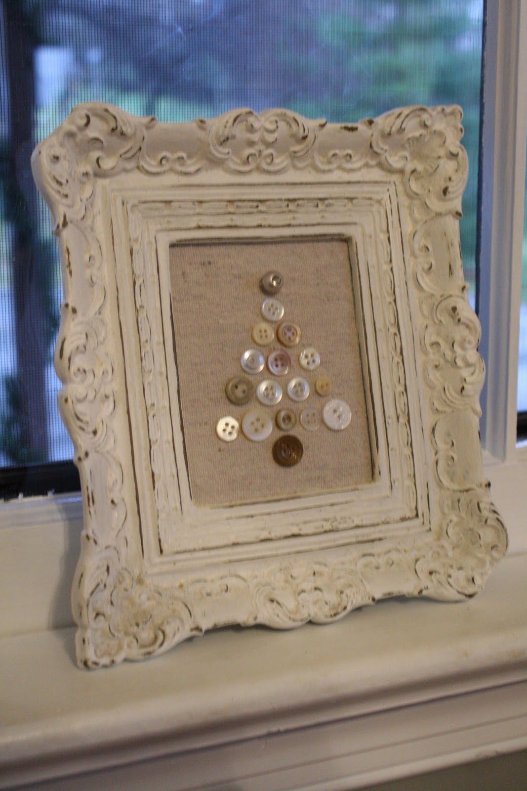 using an old frame, cover cut out cork board with drop cloth for background and
