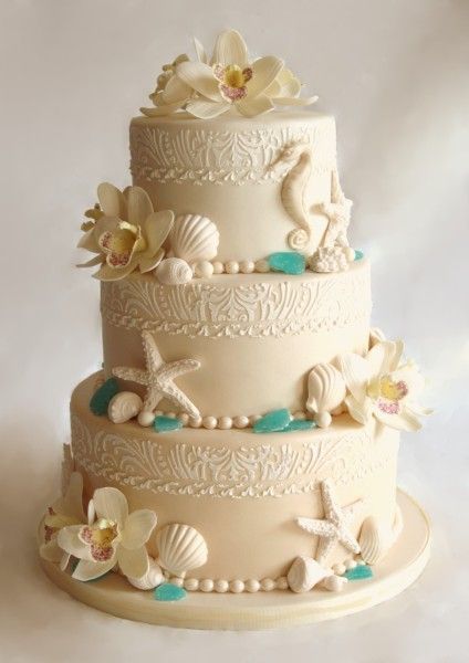Beautiful for a beach wedding. Love the detail and the pearls around the bottom