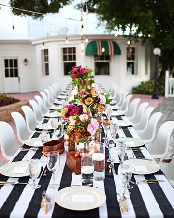 black & white stripes, modern chairs and bright flowers