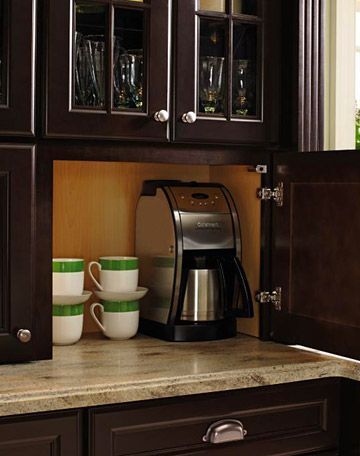 cabinets with outlets to hide toasters and coffeemakers.
