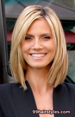 Medium length straight blonde with long layers side part and copper highlights h