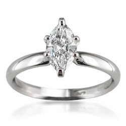 this marquis cut solitaire engagement ring is a perfect accent to a channel set