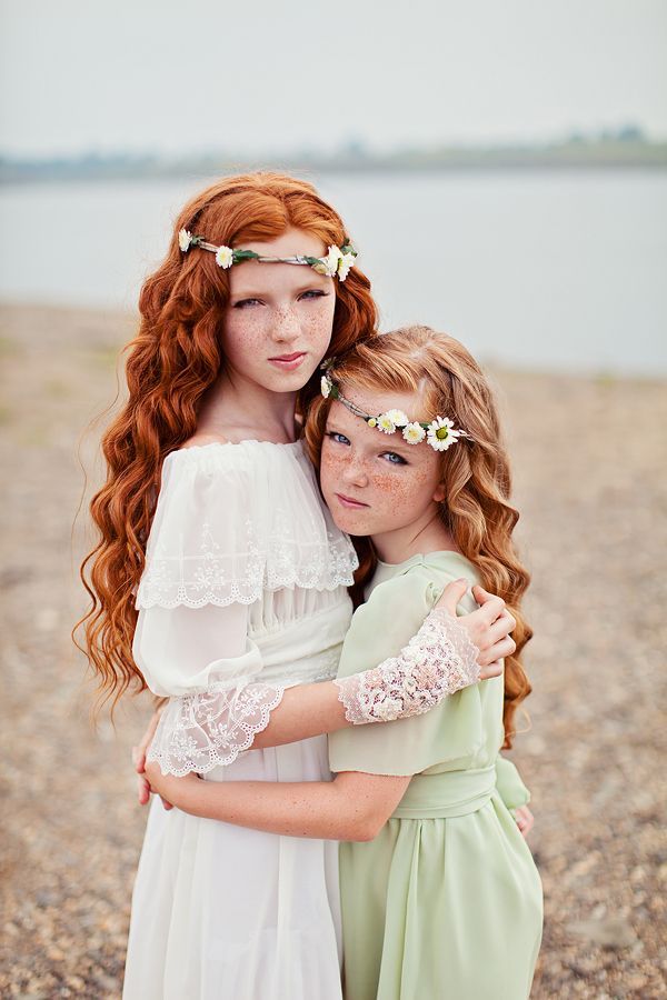 What beautiful little girls. Like the pose and hair with flowers.