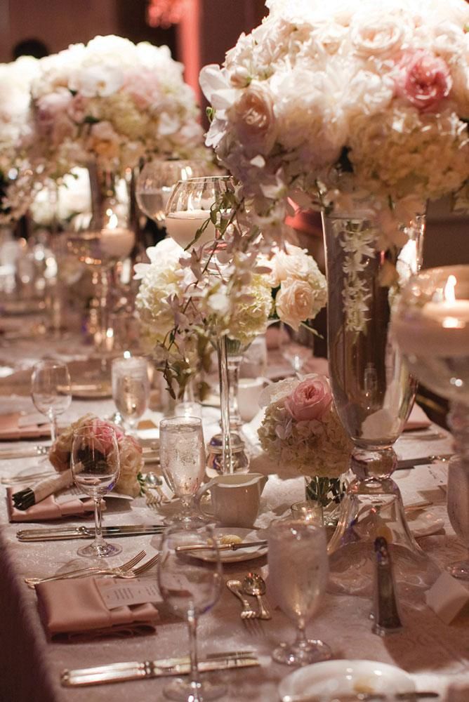 Dreamy floral centerpieces in varying heights. Photo by Thisbe Grace Photography