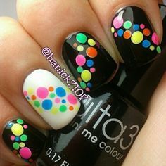 Neon dots on black and one white accent nail