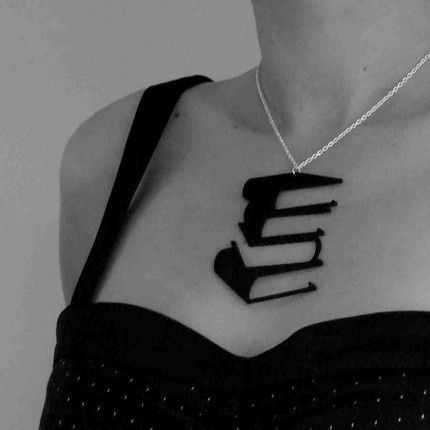 this necklace is made out of an old record. But it would make a killer tattoo. B