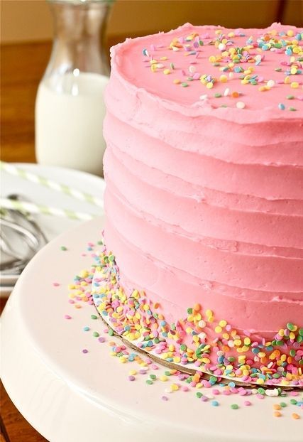 girly birthday cake, would like it more to be white or cream-colored, just not t