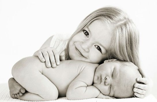 Not only is this a lovely black and white photo of Big Sister & Sleeping Newborn