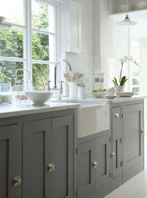 Simple straight shaker cabinets can be dressed up with ornate hardware and intri