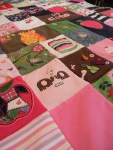 Baby quilt made from special baby clothes/items, including a small baby sock…w