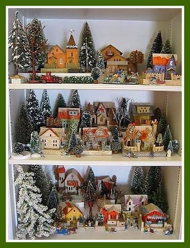 Christmas Village Shelves! Put some blue lights behind the trees and at night th