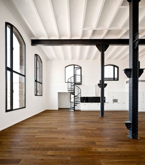 Love the stairs, huge open space, and industrial feel with hard wood floors