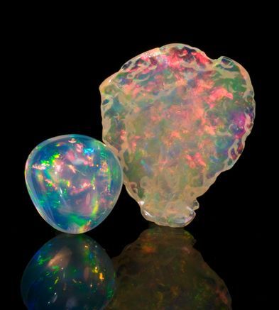 Opal: ” For in them you shall see the living fire of the ruby, the glorious purp