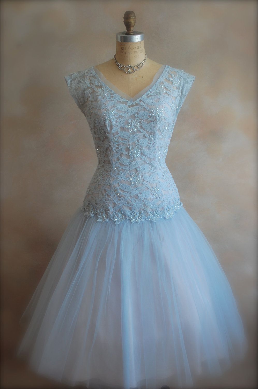 This ethereal powder blue 1950s dress features soft tulle and delicate lace.  #1